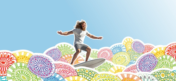 KI generiert: Ein Surfer reitet auf farbenfrohen, gemusterten Wellen unter blauem Himmel.