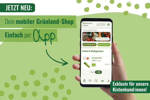 KI generiert: Hand hält Smartphone mit einer App für den Grünland-Shop. Text: "JETZT NEU: Dein mobiler Grünland-Shop. Einfach per App."